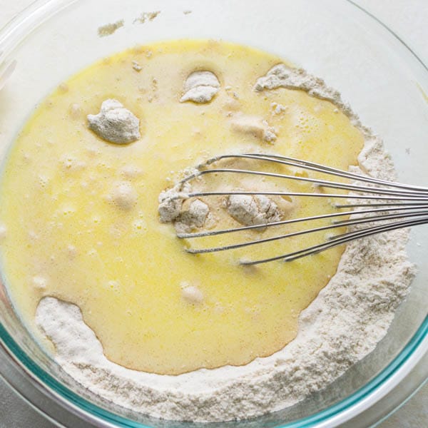 blending dry and wet ingredients with a whisk