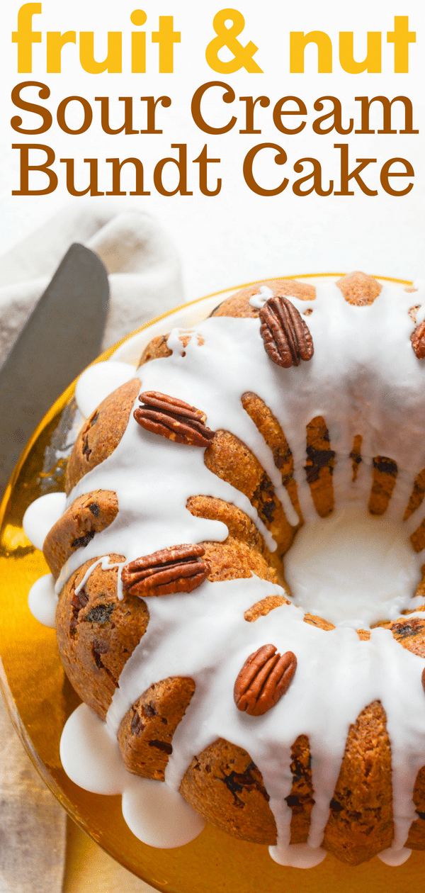 Need an easy bundt cake recipe? This sour cream bundt cake has a tasty spiced fruit-nut filling. Great for brunch & snacks, this glazed bundt cake is dandy. #bundtcake #sourcreambundt #pecancoffeecake #coffeecake #easybundtcake #sourcreambundtcake #apricot #sourcream #dessert #brunchdessert #breakfast #snackcake #cinnamon #bundtcakefilling #coffeecakefilling 