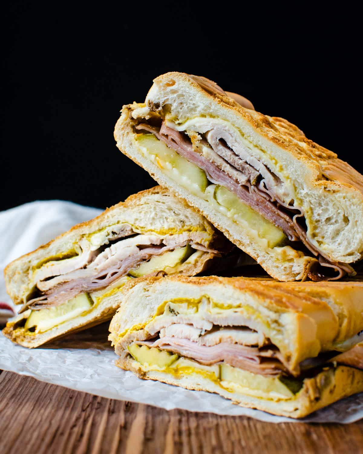 A stack of cuban sandwiches.