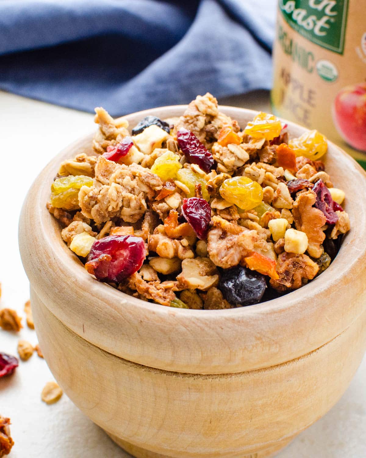 crunchy granola with dried fruit in a wooden bowl.