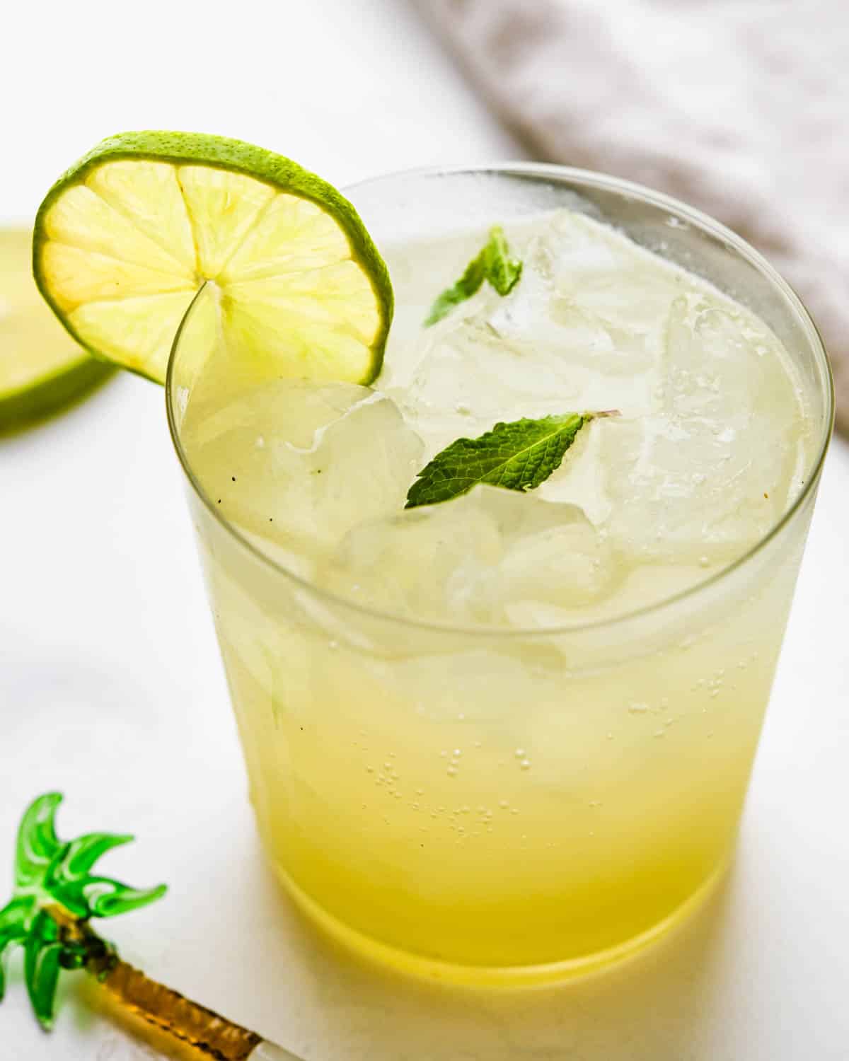 Serving an ice cold guava limeade with mint leaves.