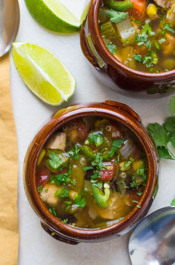 Southwestern Chicken Quinoa Soup with lime wedges