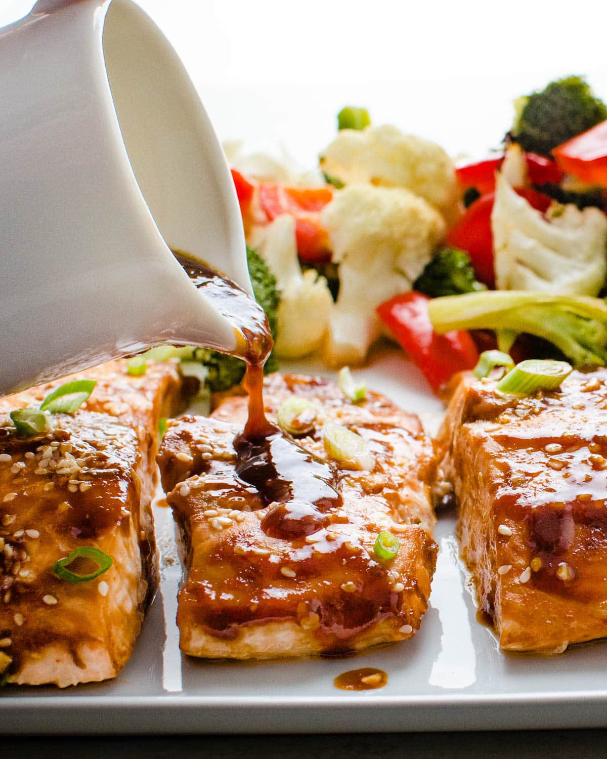 Topping baked salmon with an asian glaze.