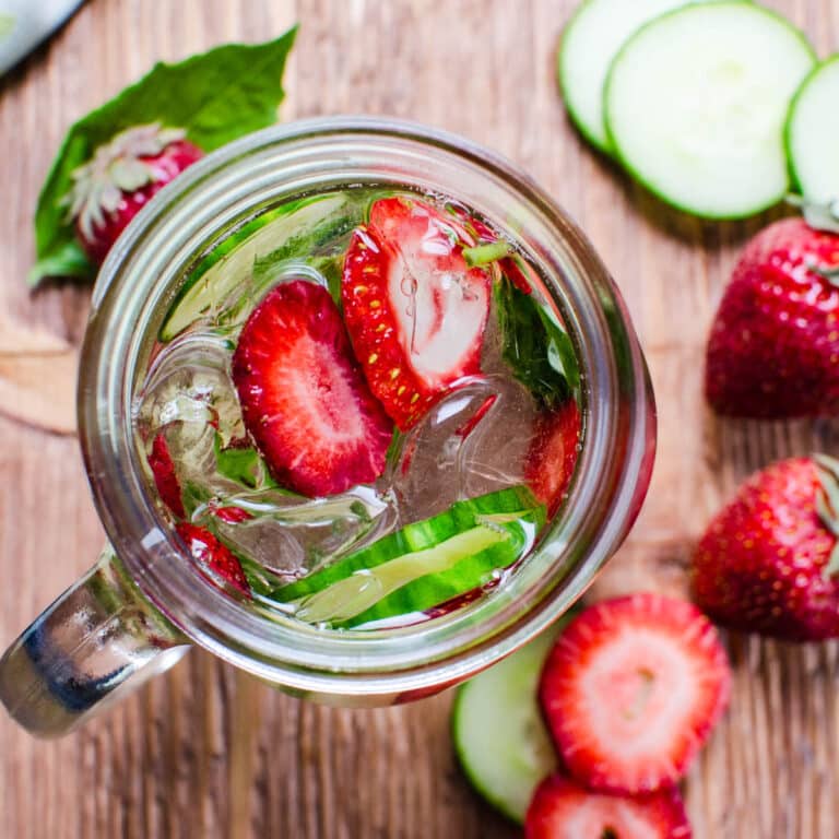 An overhead of the strawberry basil water in a glass.