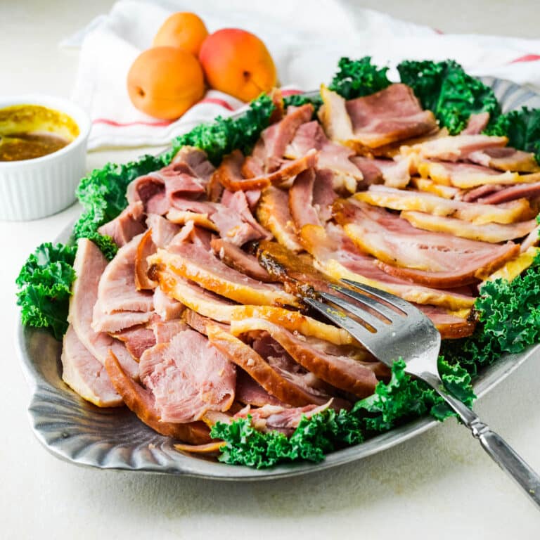 sliced glazed ham on a platter.