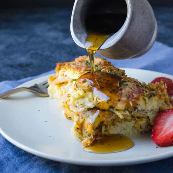 adding syrup to easy overnight breakfast casserole.