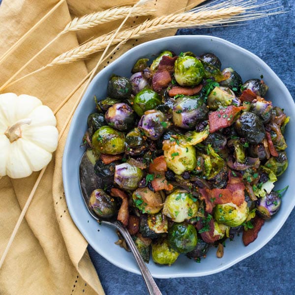 Serving Tangy Glazed Stovetop Brussels Sprouts in a serving dish.