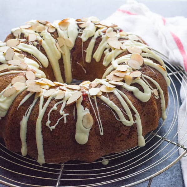 decorating the moist coffee cake with white chocolate and almonds.