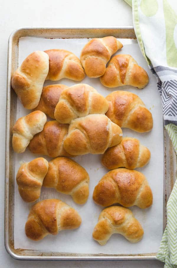 batch of crescent rolls on a baking sheet.