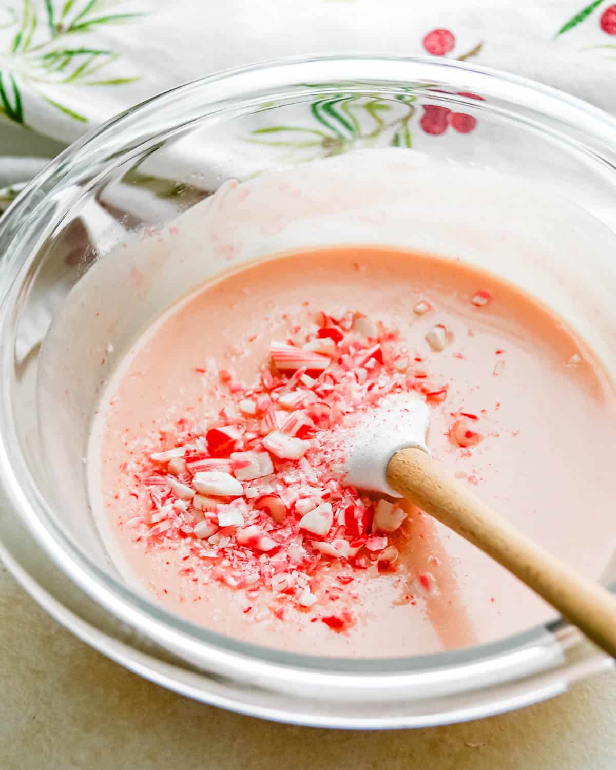 Stirring up crushed candy canes into the white chocolate.