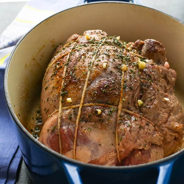 searing boneless lamb roast recipe in a dutch oven.