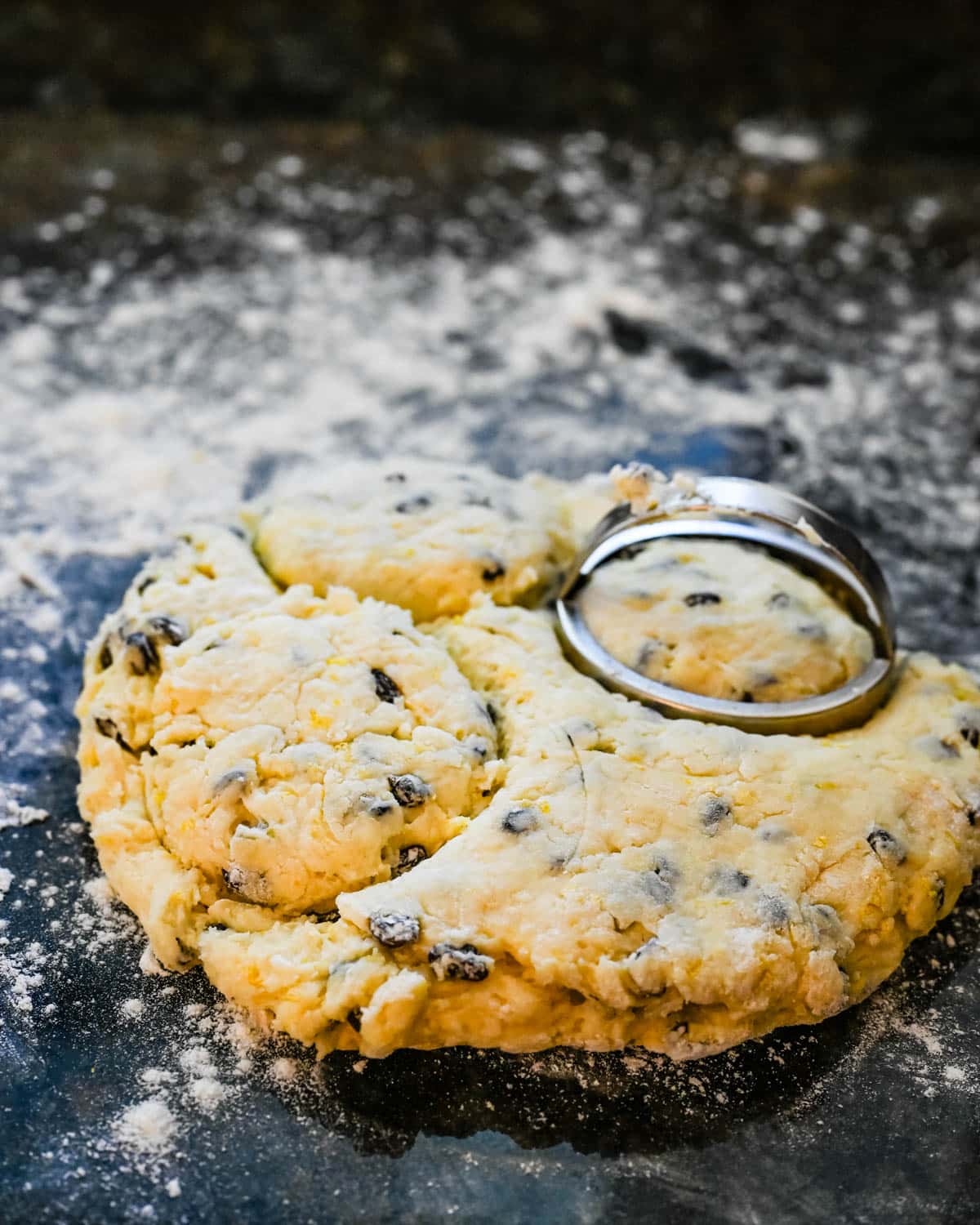 Cutting the scones with a biscuit cutter.