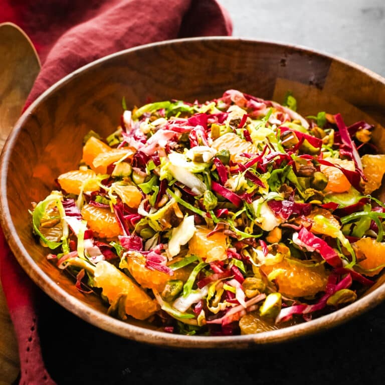 A radicchio and brussels sprouts salad with mandarin oranges.