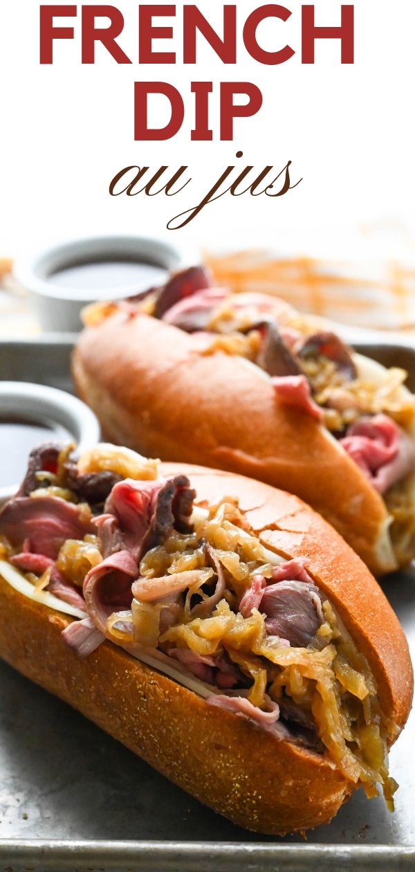 If you crave a hot roast beef sandwich try this French Dip au jus with thinly sliced roast beef piled on a sturdy roll w/cheese, caramelized onions & jus! #frenchdipaujus #slicedroastbeef #hotroastbeefsandwich