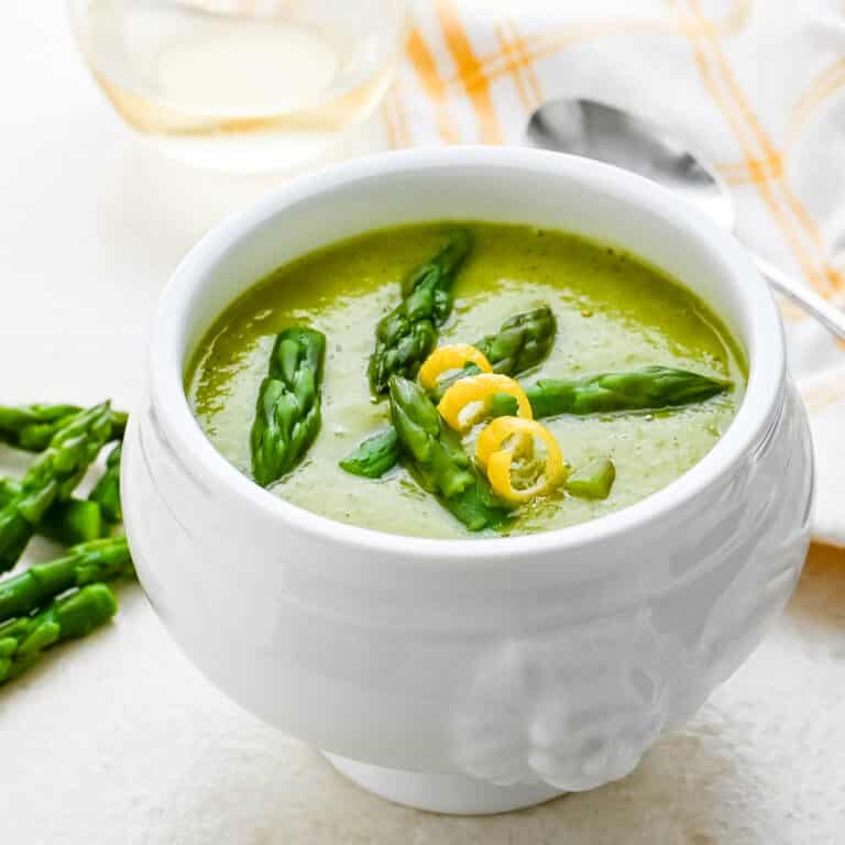 A bowl of creamy vegan asparagus soup.