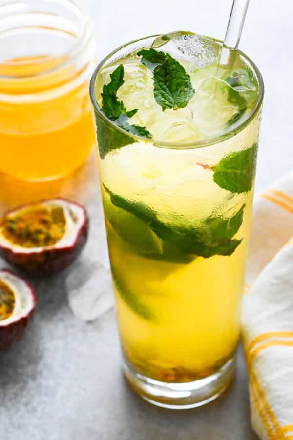 frosty passion mojito with mint leaves, lime and passion fruit seeds.