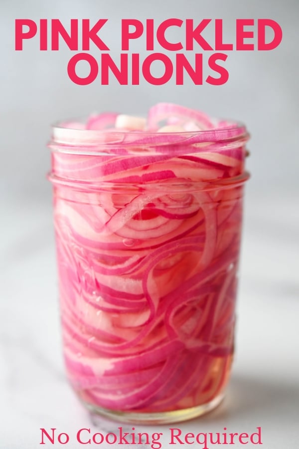 These 5-ingredient, 5-minute pink pickled onions are great toppings for tacos, sandwiches & more. Making brine for tart sweet pickled onions is a snap too! #pickledonions #howtopickleonions