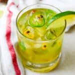 A spicy Passion Fruit Margarita with lime wedge.