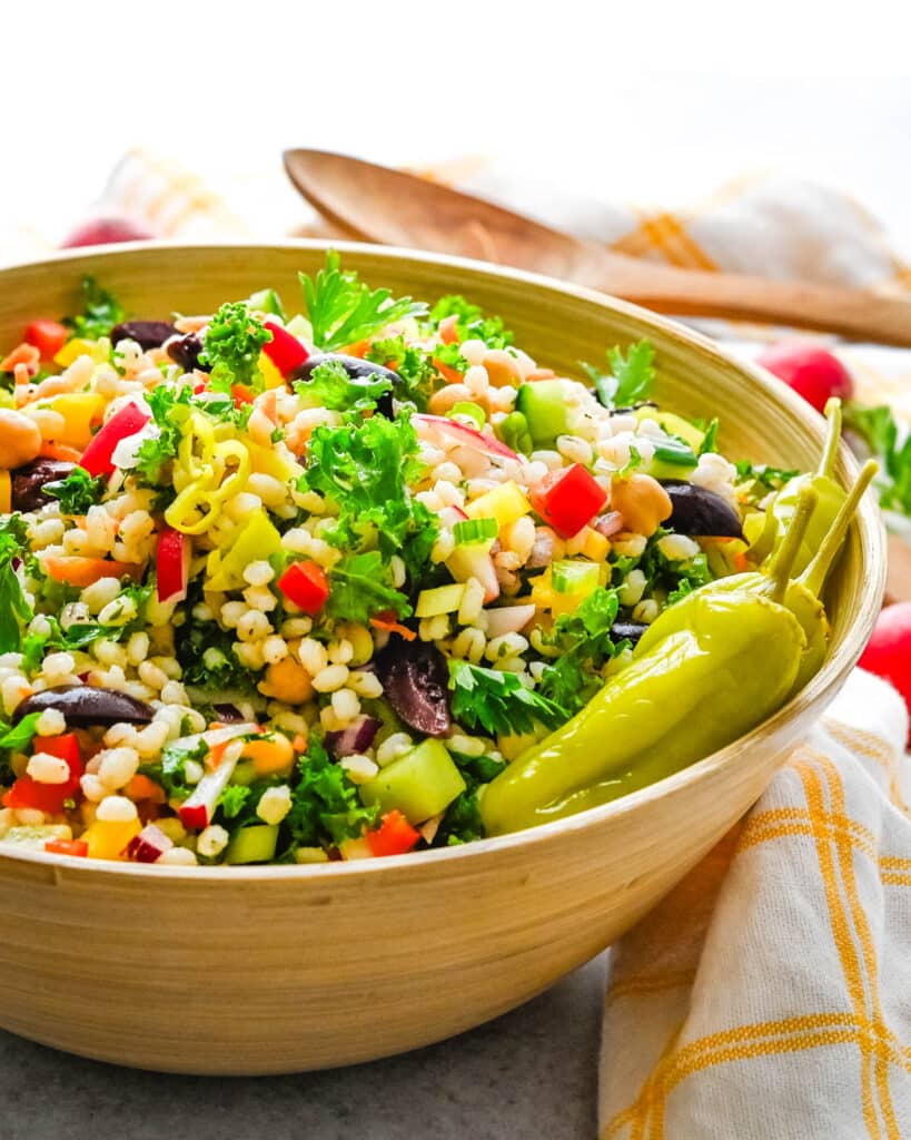 Chopped kale and barley salad with pepperoncini.