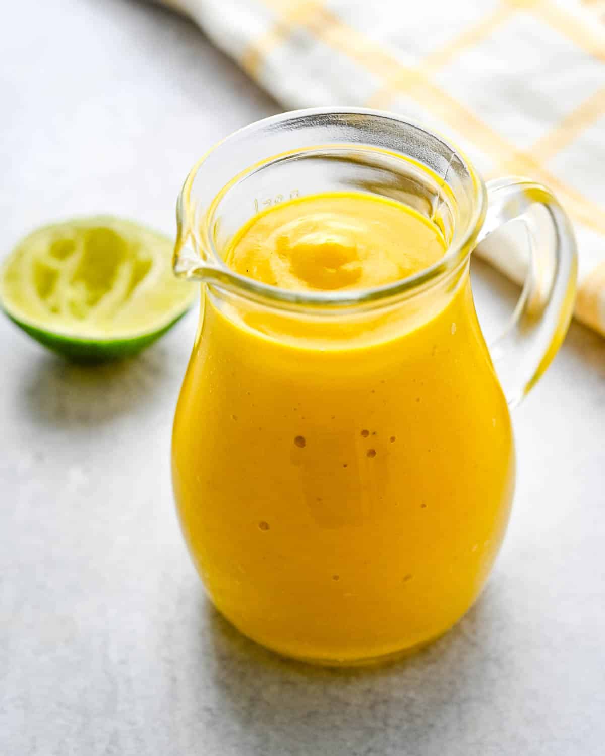 A jar of curried mango salad dressing.