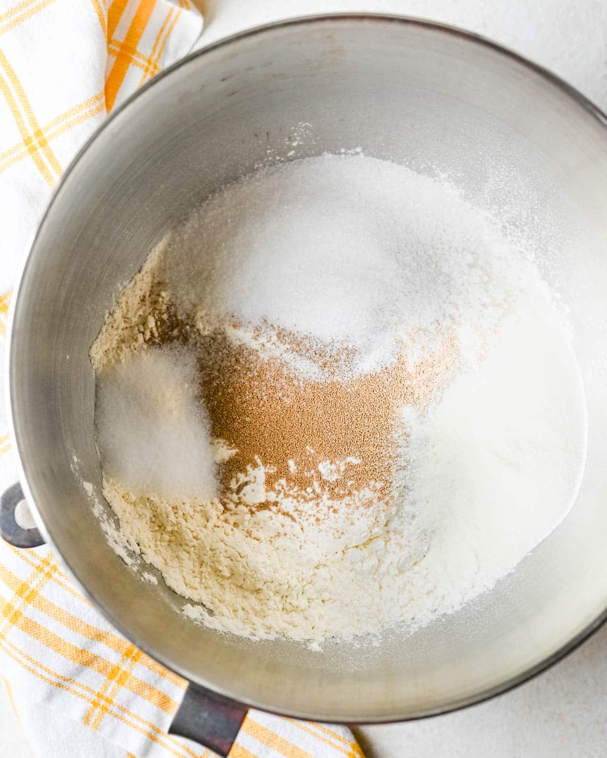 Mixing the dry ingredients for the cinnamon roll dough.
