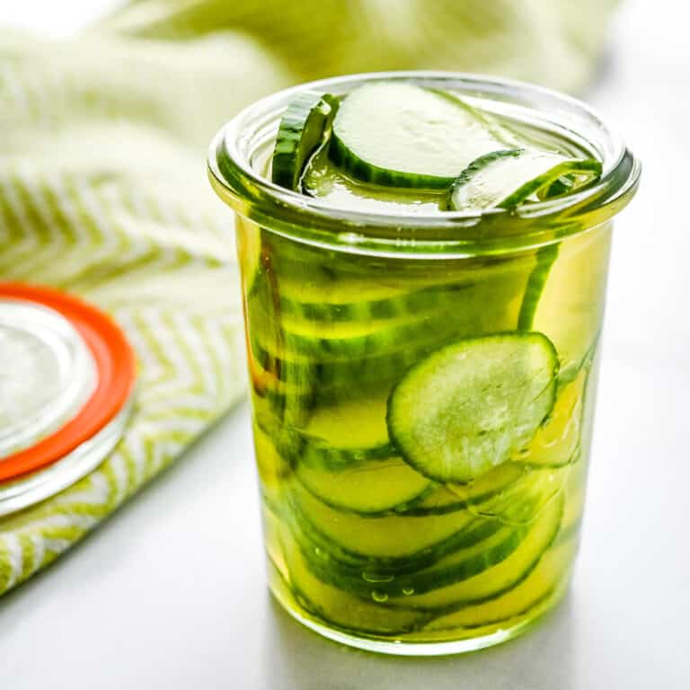 A jar of quick pickled cucumbers.