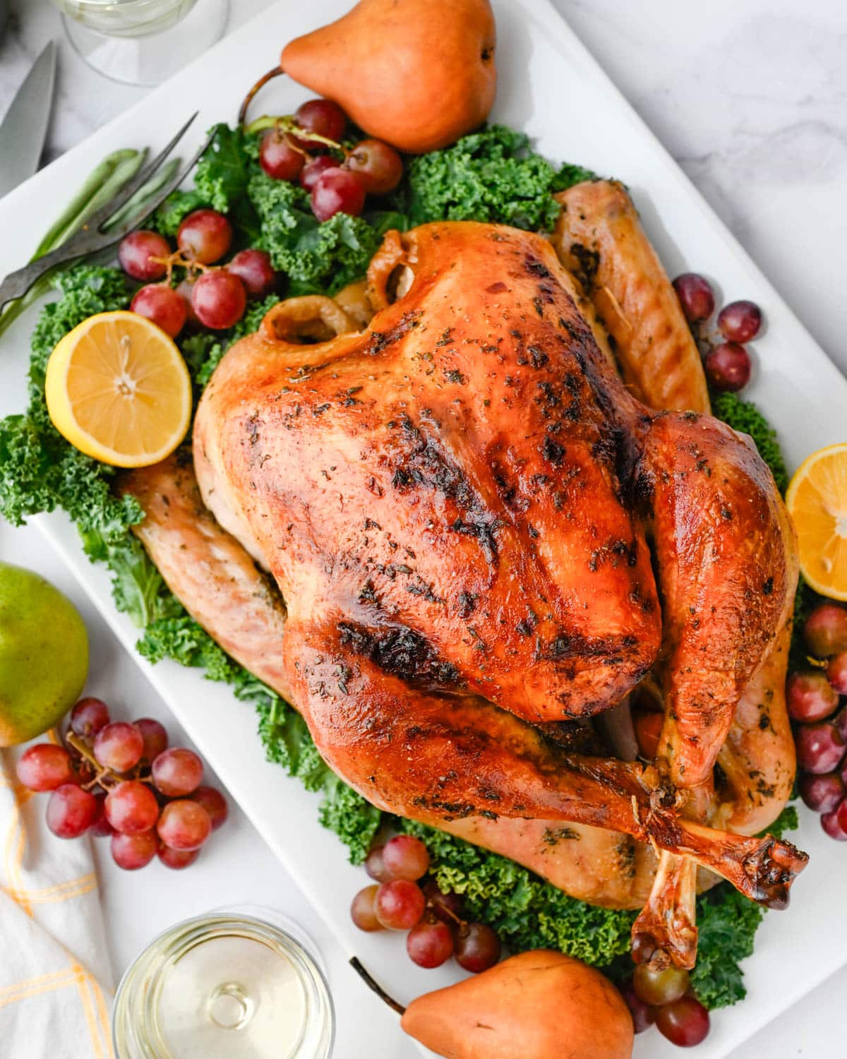 A whole roast turkey on a serving platter.