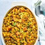 Cornbread with sausage stuffing in a casserole dish.