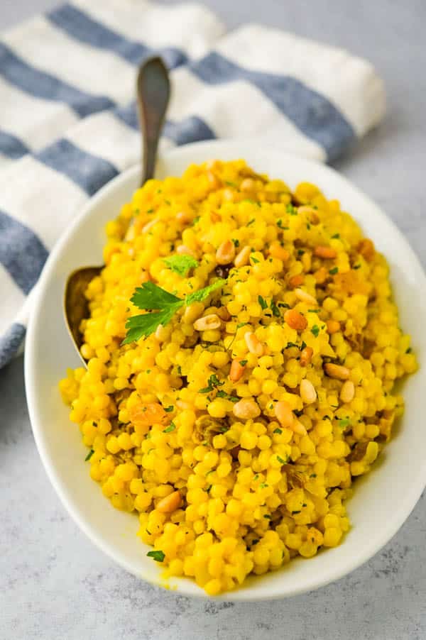 Serving turmeric couscous as a side dish.
