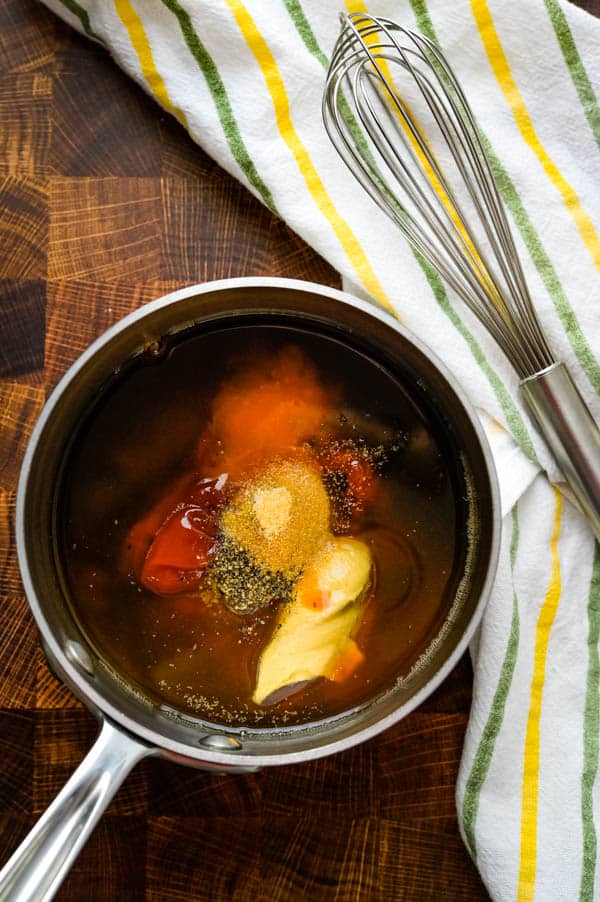 adding ingredients to a saucepan.