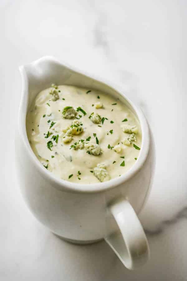 homemade chunky blue cheese dressing in a pitcher.