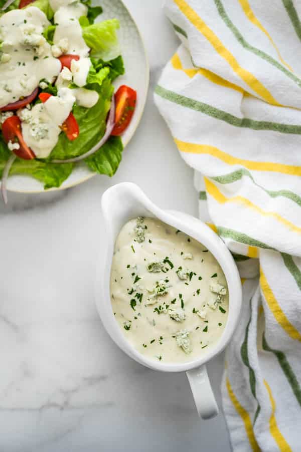 dressing a salad with the best blue cheese dressing
