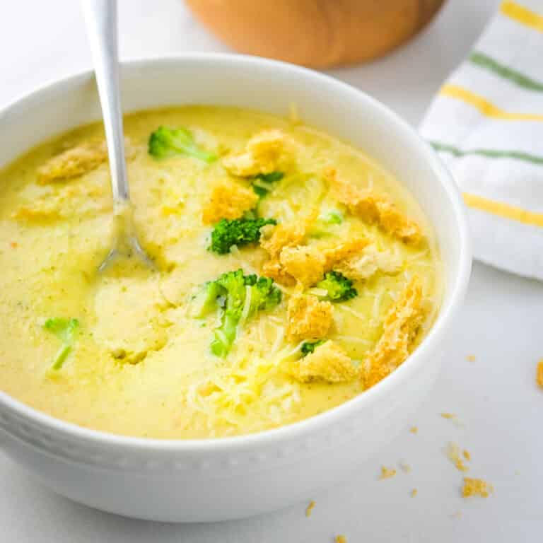 A bowl of creamy broccoli cheese soup.