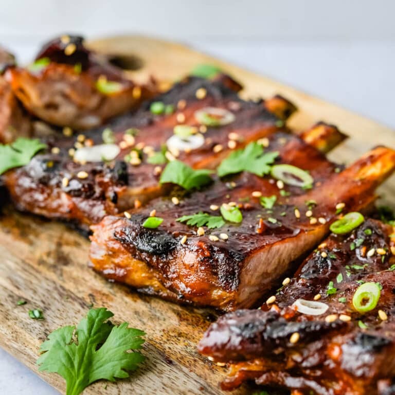 Serving Korean ribs with green onion and sesame seeds.