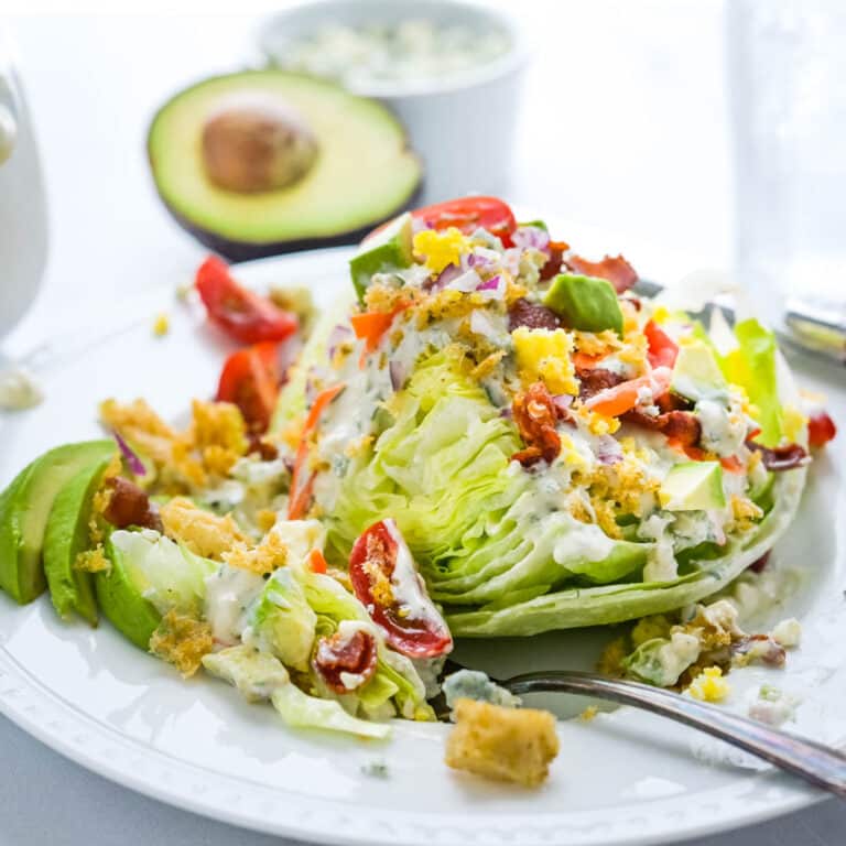 A wedge salad with all the fixings.