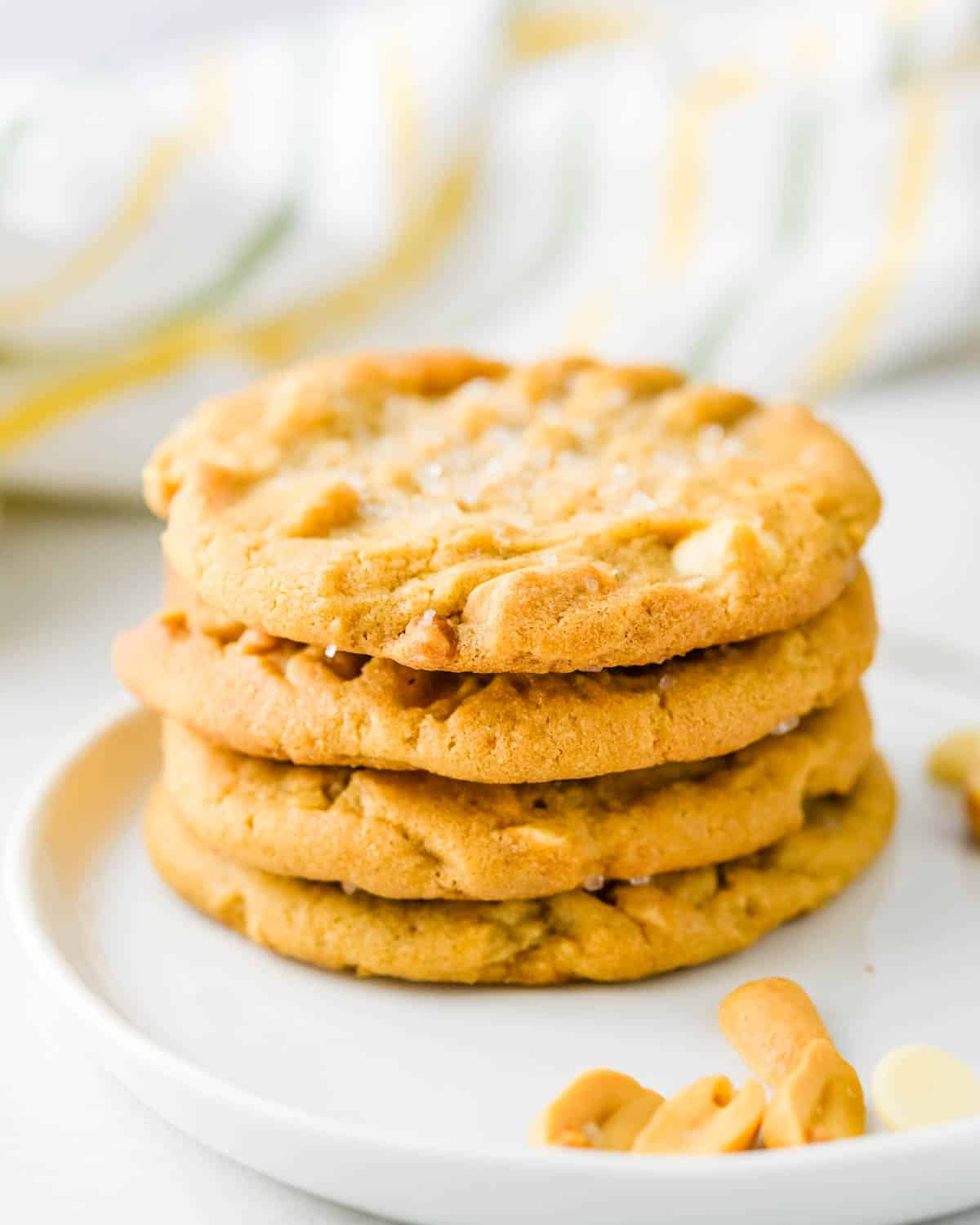 A stack of peanut butter cookies on a plate.
