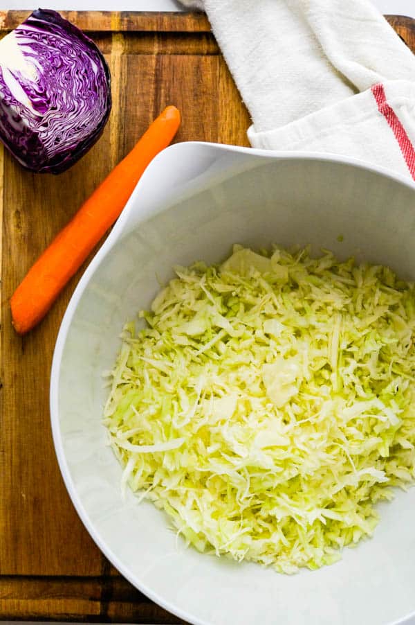 shredded green cabbage in a bowl.