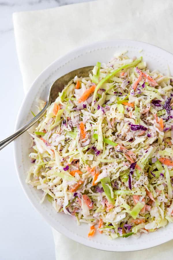 Serving cabbage slaw in a bowl.