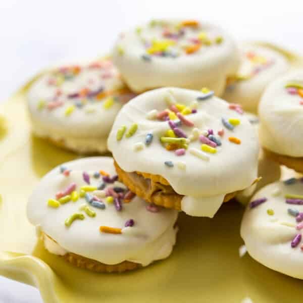 A platter of pastel-colored Ritz cracker cookies.