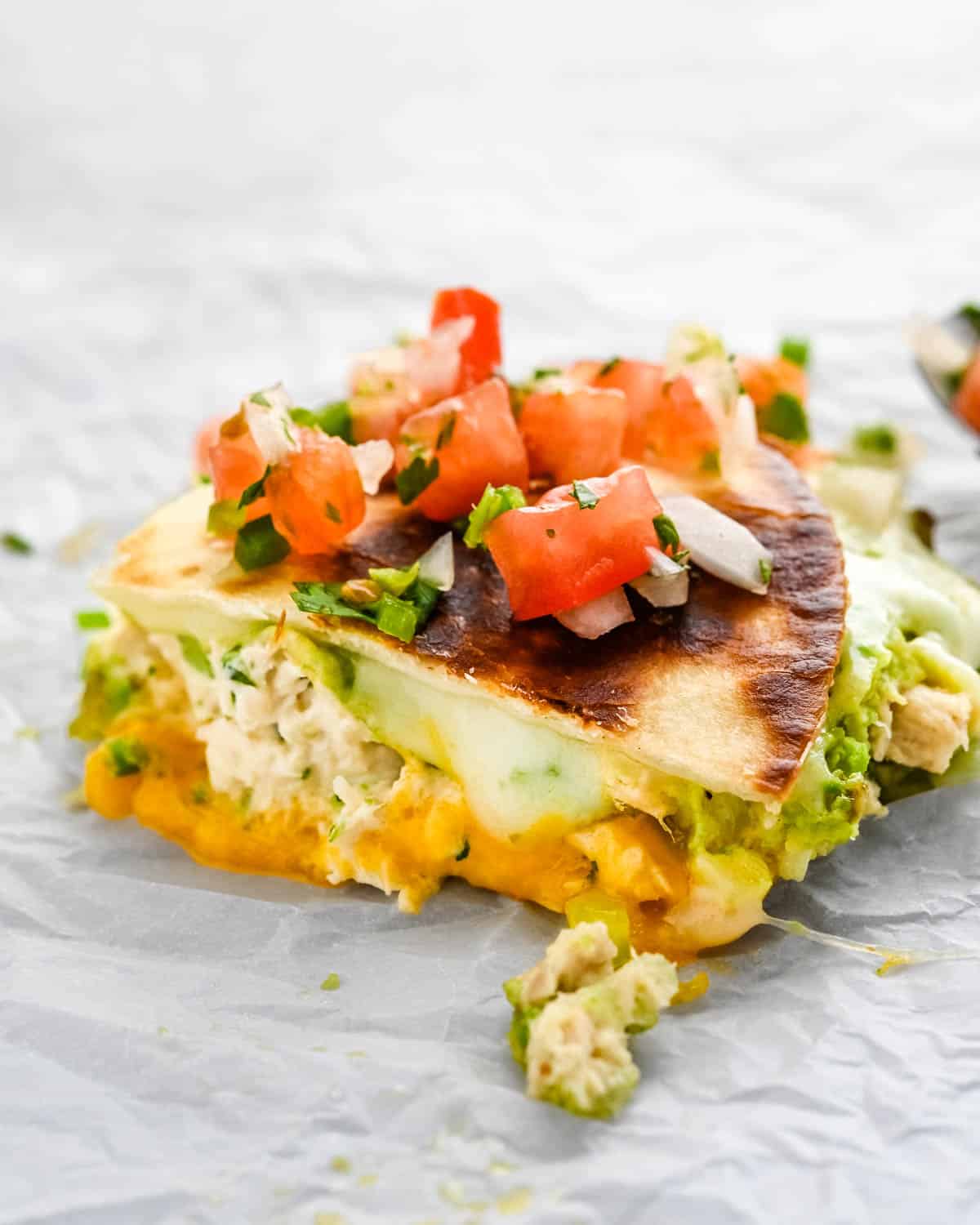 tuna melt quesadillas with a topping of pico de gallo.
