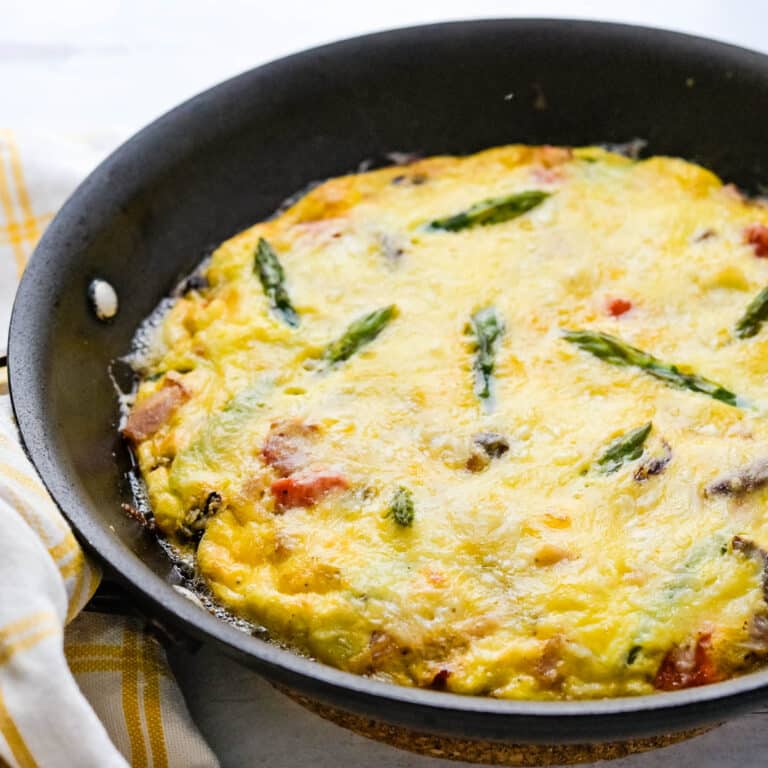 A ham cheese and asparagus frittata hot from the oven.