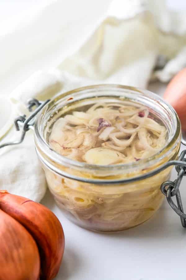 shallot confit in a jar.