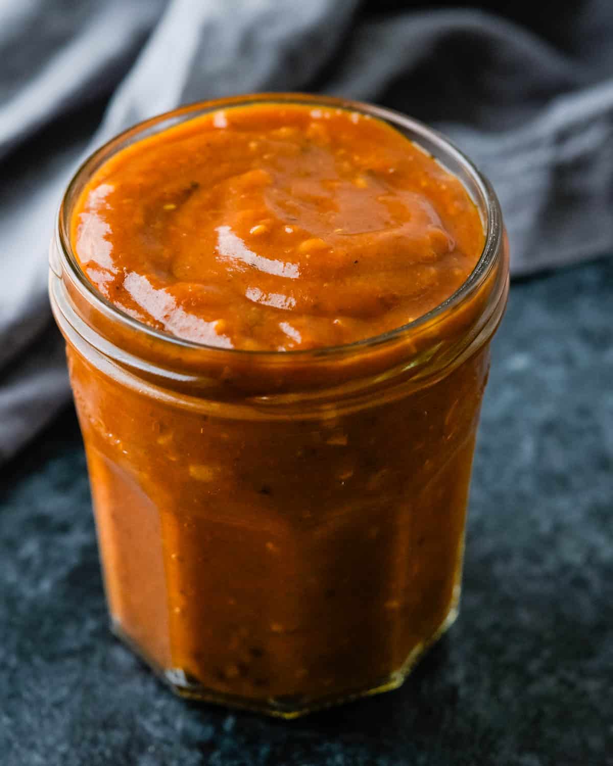 A jar of red enchilada sauce.