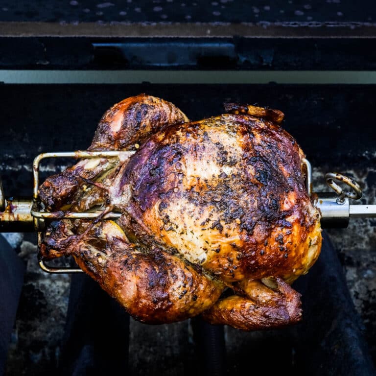 We are grilling rotisserie chicken on a spit.