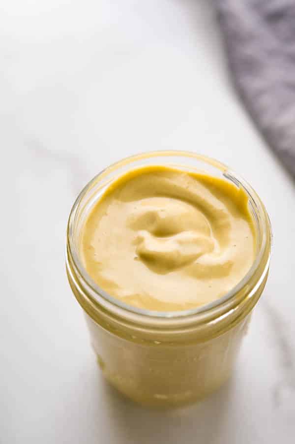 Creamy anchovy vinaigrette salad dressing in a jar. 