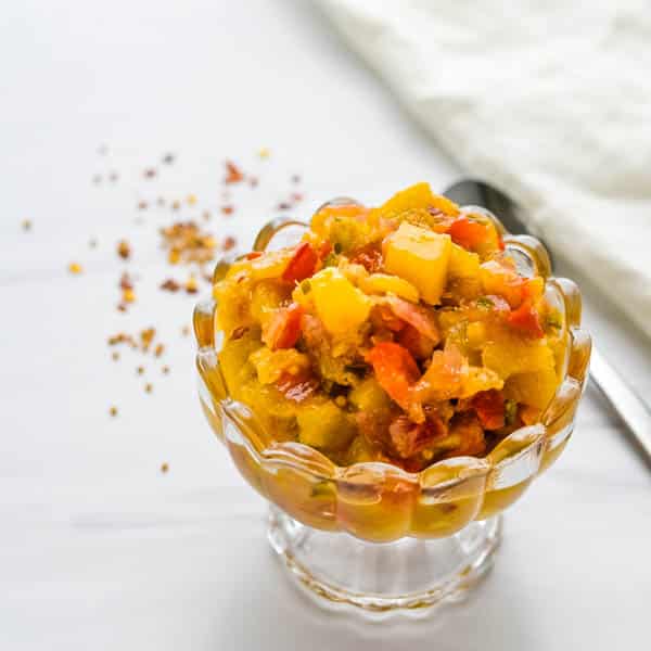 Pineapple Rum Chutney in a glass serving dish.