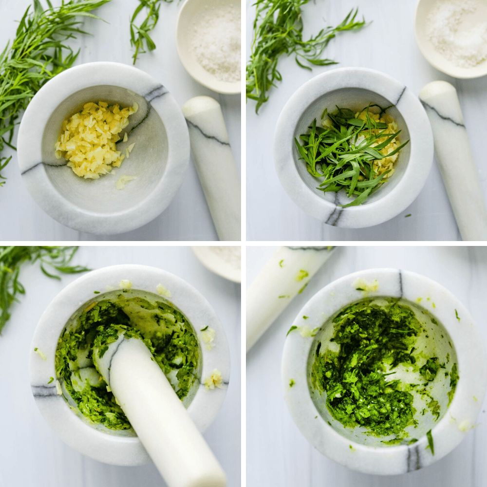 making tarragon paste for the aioli in a mortar and pestle.