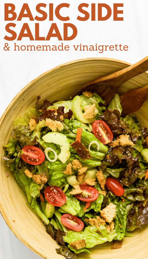 A pin of the green salad in a bowl with dressing and extras.