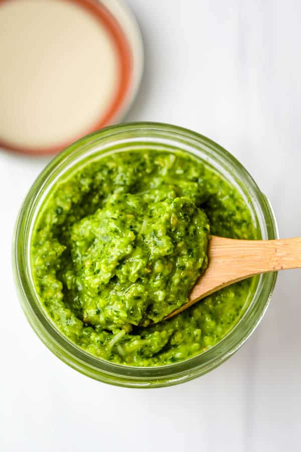 spinach basil pesto in a jar, ready to use in the pasta.