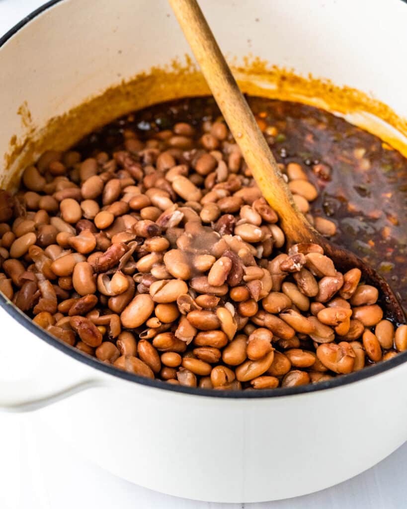 Add the par-cooked beans back to the pot. 